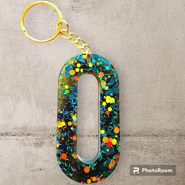 Resin / Epoxy Keychain Letter O - Hand poured and uniquely made. Size 2 1/2" x 1 1/2"