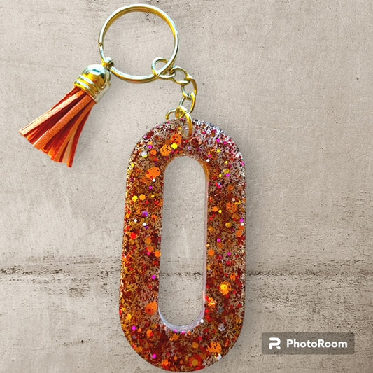 Resin / Epoxy Keychain Letter O - Hand poured and uniquely made. Size 2 1/2" x 1 1/2"