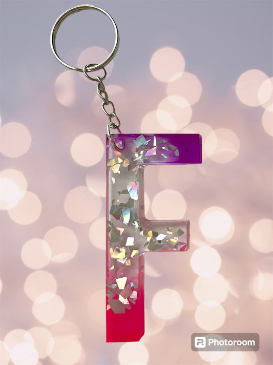 Resin / Epoxy Keychain Letter  - Hand poured and uniquely made. Size 2 1/2" x 1 1/2” pink, purple & glitter